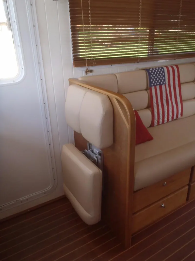 Slide: The Image of Interior of 2025 Great Harbour N40 yacht with American flag decor and wooden furnishings. - 30