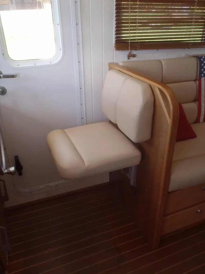 Slide: The Image of Interior of 2025 Great Harbour N40 yacht with beige seating and wooden accents. - 31