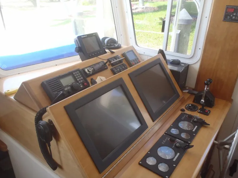 Slide: The Image of Great Harbour N40 2025 helm with dual screens and navigation controls. - 40
