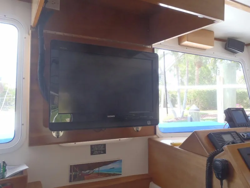 Slide: The Image of Interior of 2025 Great Harbour N40 boat with mounted TV and navigation equipment. - 41
