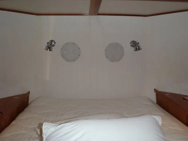 Slide: The Image of Cozy cabin interior of 2025 Great Harbour N40 with bed and porthole windows. - 49