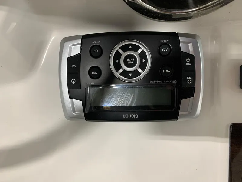 Slide: The Image of Clarion audio control panel on 2024 Robalo R222 Explorer boat. - 12