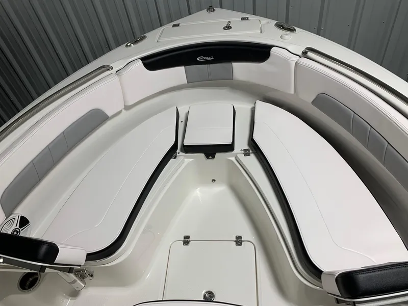 Slide: The Image of 2024 Robalo R222 Explorer boat interior with white cushioned seating. - 5