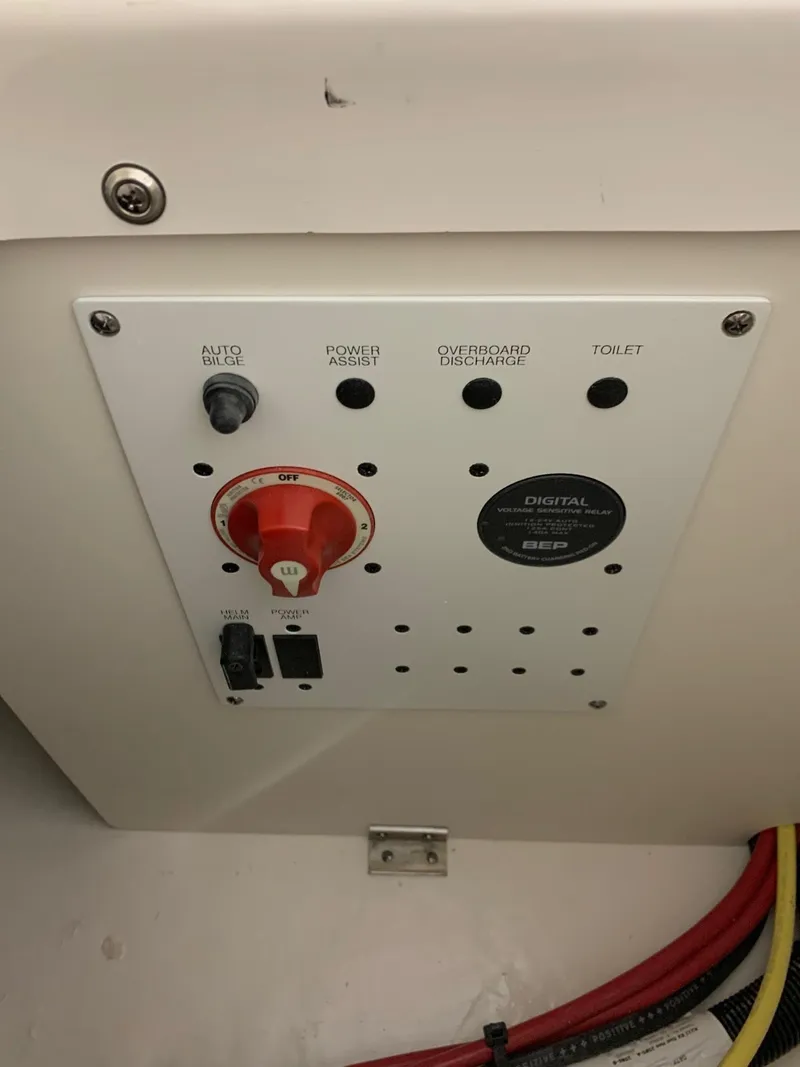 Slide: The Image of Control panel of 2024 Robalo R222 Explorer boat with switches and wiring. - 7