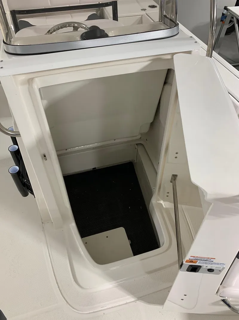 Slide: The Image of 2024 Robalo 226 Cayman boat storage compartment. - 12
