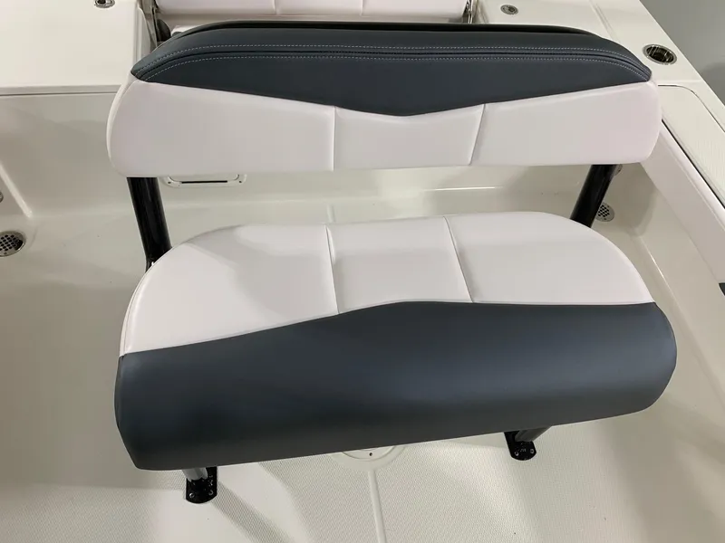 Slide: The Image of 2024 Robalo 226 Cayman boat seat with black and white upholstery. - 3