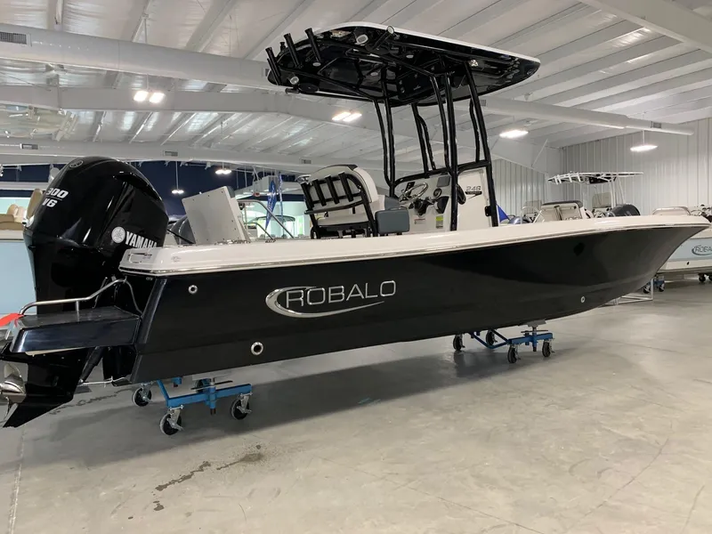 The Image of 2024 Robalo 246 Cayman boat in showroom, black hull, Yamaha engine. - 0