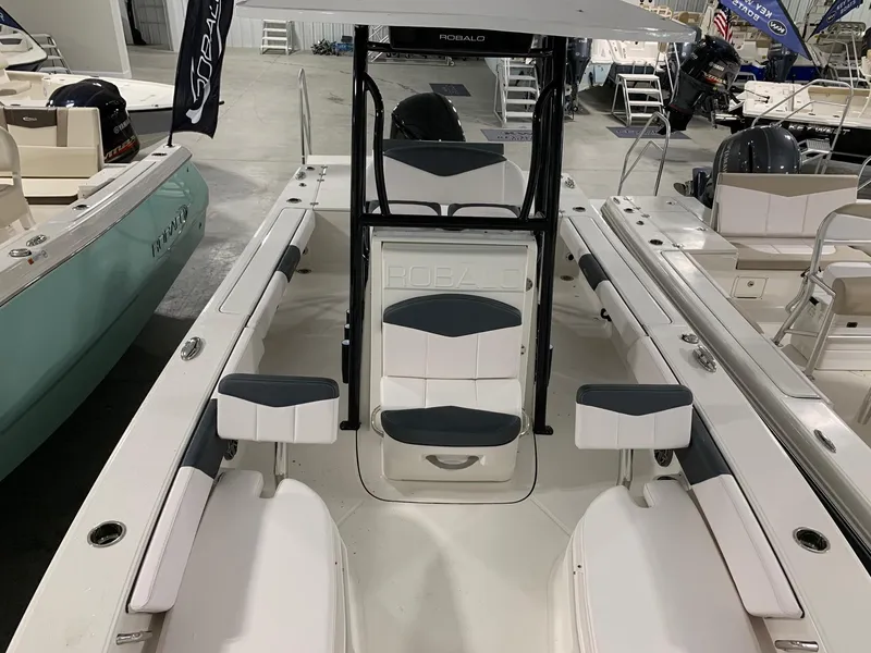 Slide: The Image of 2024 Robalo 246 Cayman boat interior with seating and console. - 3