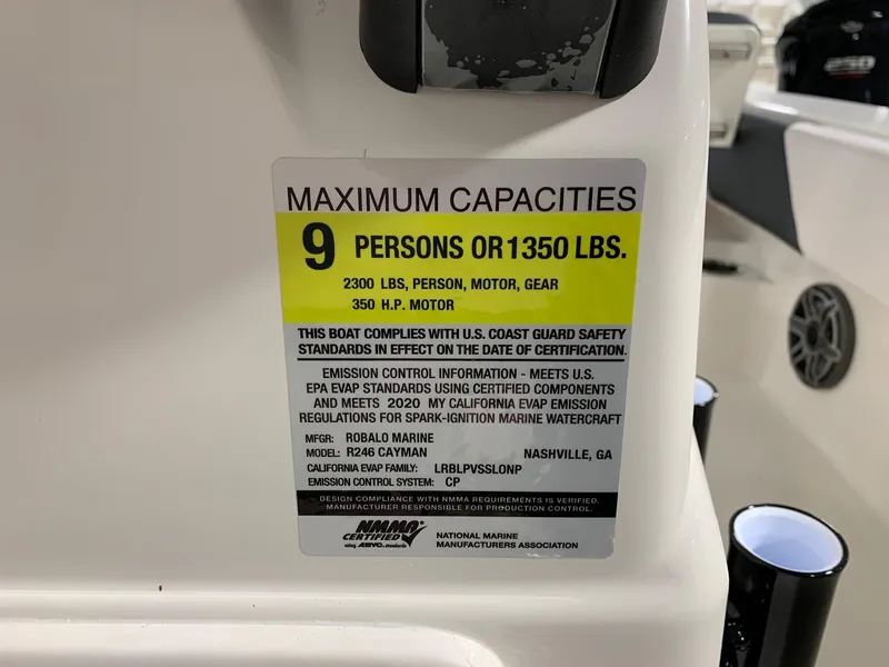 Slide: The Image of 2024 Robalo 246 Cayman boat capacity label: 9 persons or 1350 lbs, 350 HP motor. - 9