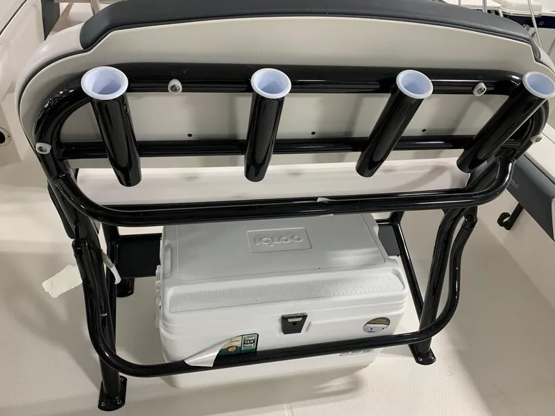 Slide: The Image of 2024 Robalo 246 Cayman boat seat with rod holders and cooler. - 12