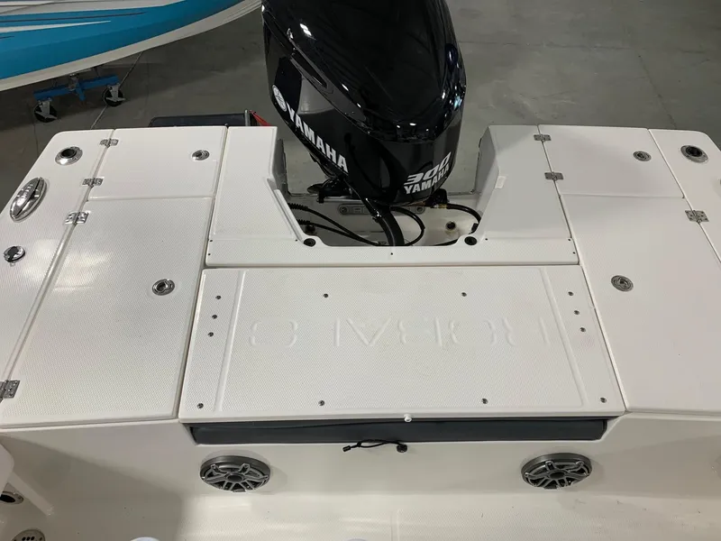 Slide: The Image of 2024 Robalo 246 Cayman boat with Yamaha engine, rear deck view. - 15