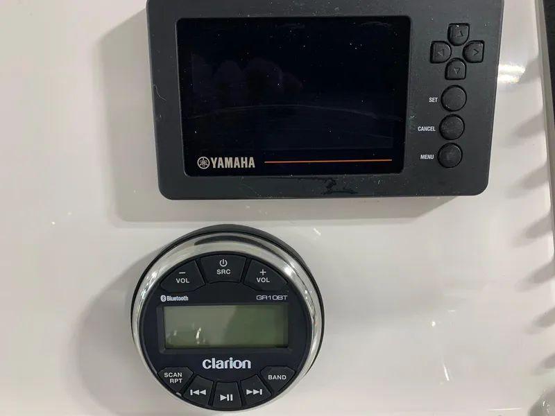 Slide: The Image of Yamaha and Clarion control panels on 2024 Robalo 246 Cayman boat. - 17