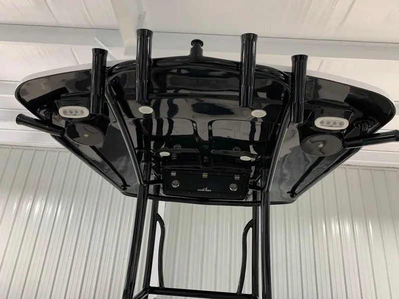 Slide: The Image of 2024 Robalo 246 Cayman T-top with rod holders and LED lights. - 5