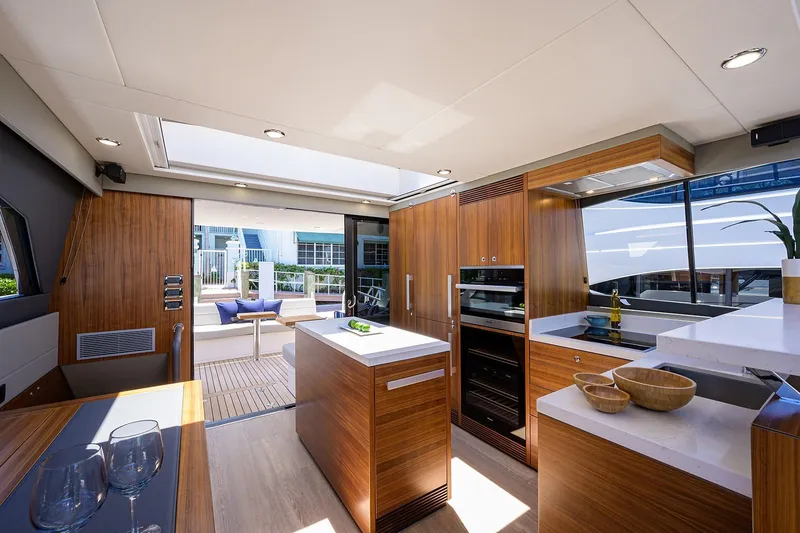 Slide: The Image of Luxurious kitchen and lounge on the 2020 Maritimo X60 yacht. - 18