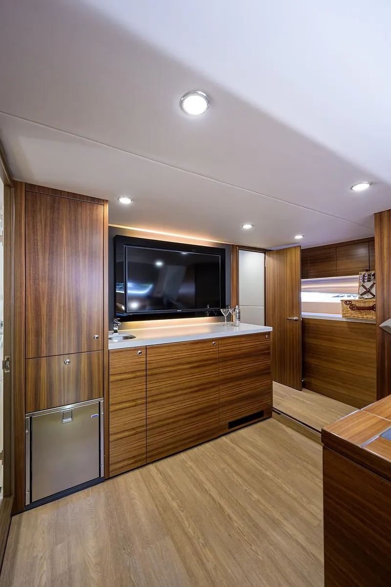 Slide: The Image of Interior of 2020 Maritimo X60 yacht with wood paneling and modern amenities. - 46