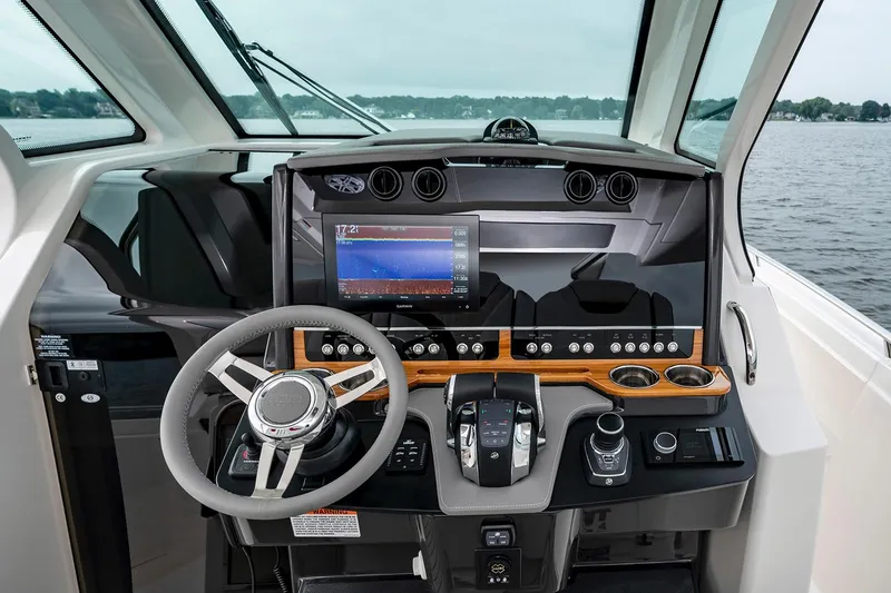 Slide: The Image of Helm of 2025 Tiara Sport 34 LS boat with advanced navigation system. - 18