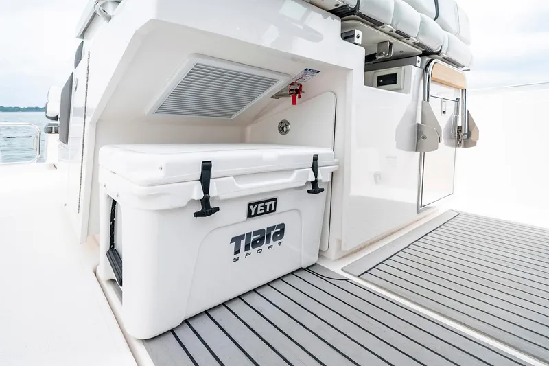 Slide: The Image of 2025 Tiara Sport 34 LS boat with Yeti cooler on deck. - 19