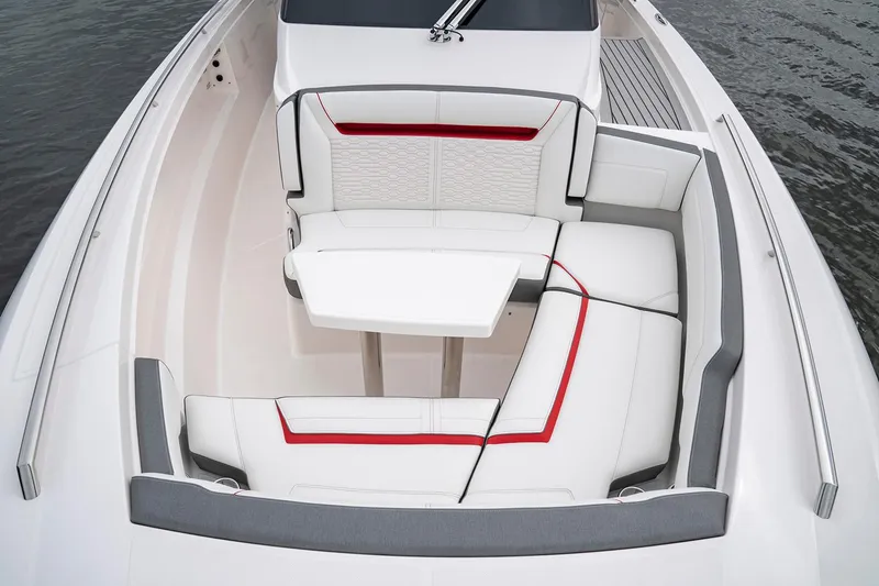 Slide: The Image of 2025 Tiara Sport 34 LS boat interior with white and red seating. - 21