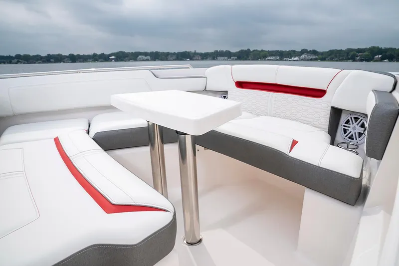 Slide: The Image of Interior seating area of the 2025 Tiara Sport 34 LS boat with white and red upholstery. - 22