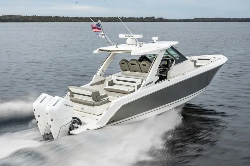 Slide: The Image of 2025 Tiara Sport 34 LS boat cruising on a lake. - 3