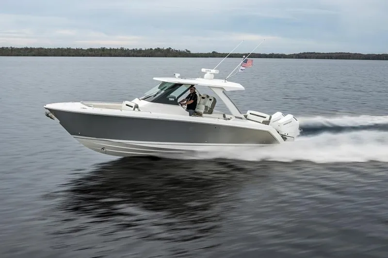Slide: The Image of 2025 Tiara Sport 34 LS boat cruising on a lake. - 4