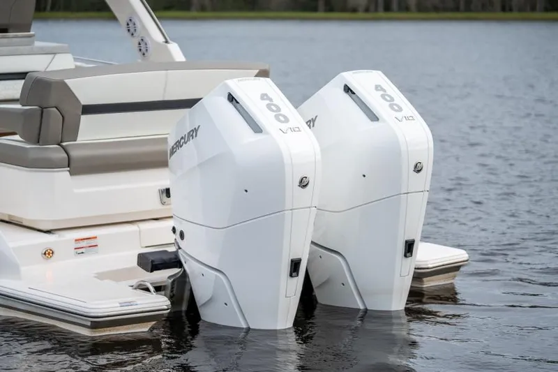 Slide: The Image of 2025 Tiara Sport 34 LS with twin Mercury outboard engines on water. - 5
