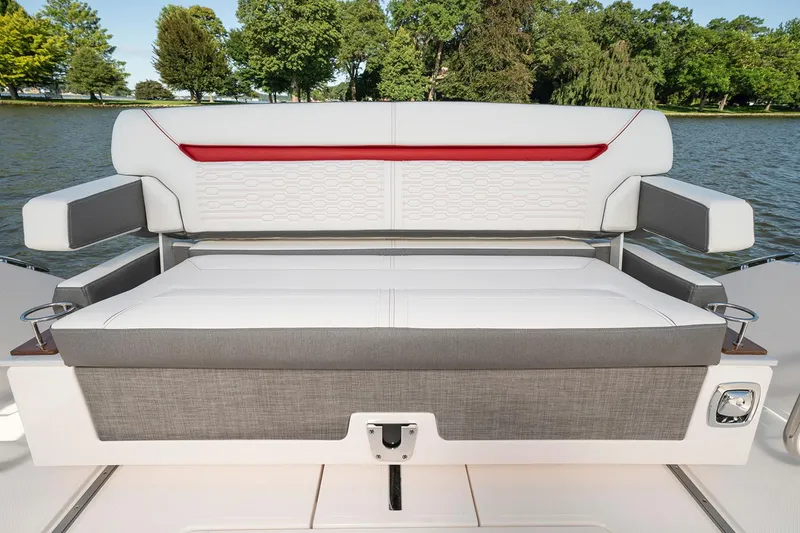 Slide: The Image of 2025 Tiara Sport 34 LS boat seating with scenic lake background. - 7