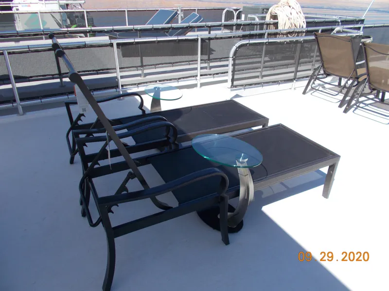 Slide: The Image of Sumerset Antelope Escape 2020 deck with lounge chairs and glass tables. - 14