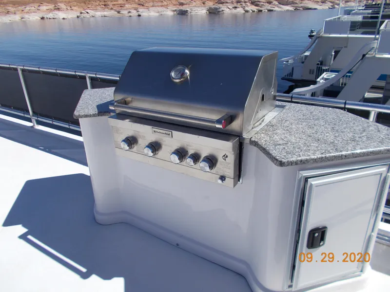Slide: The Image of Outdoor grill on Sumerset Antelope Escape Share #4 houseboat, 2020 model, by a lake. - 15