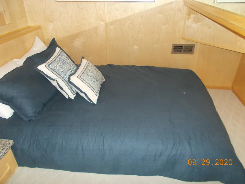 Slide: The Image of Cozy bedroom in 2020 Sumerset Antelope Escape Share #4 houseboat with blue bedding. - 25