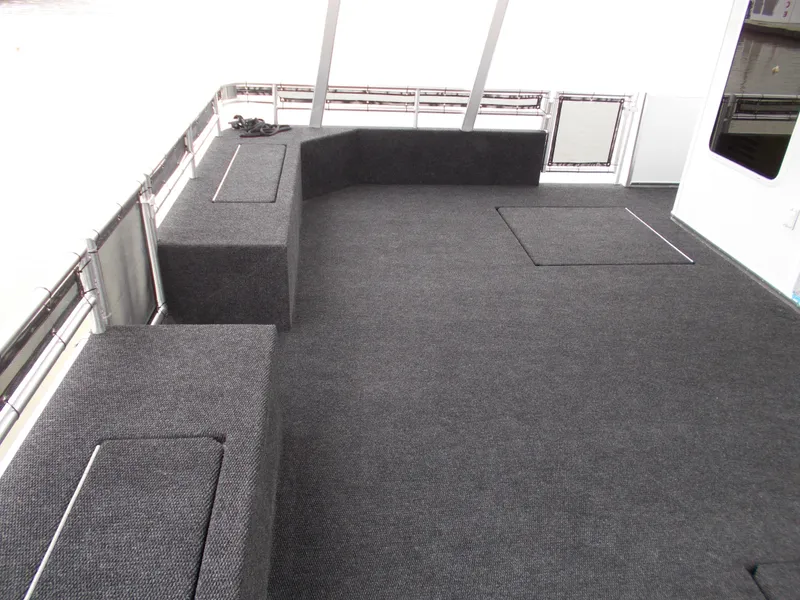 Slide: The Image of 2020 Sumerset Antelope Escape Share #4 houseboat deck with carpeted seating. - 3