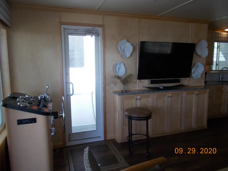 Slide: The Image of Interior of 2020 Sumerset Antelope Escape Share #4 with TV and control panel. - 33