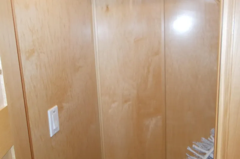 Slide: The Image of Wood-paneled interior of 2020 Sumerset Antelope Escape Share #4 houseboat. - 39