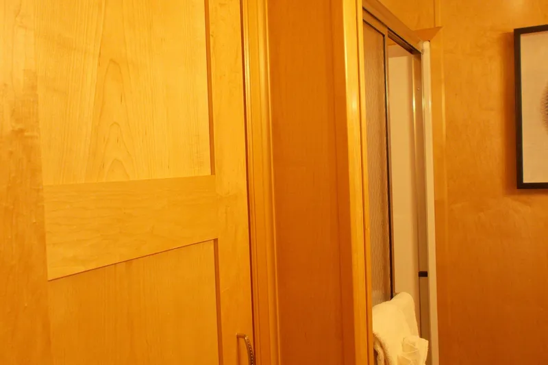 Slide: The Image of Wooden interior of 2020 Sumerset Antelope Escape Share #4, featuring a door and towel. - 42