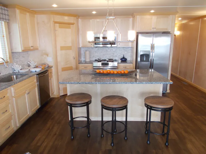 Slide: The Image of Modern kitchen in 2020 Sumerset Antelope Escape Share #4 houseboat with island and stainless steel appliances. - 5