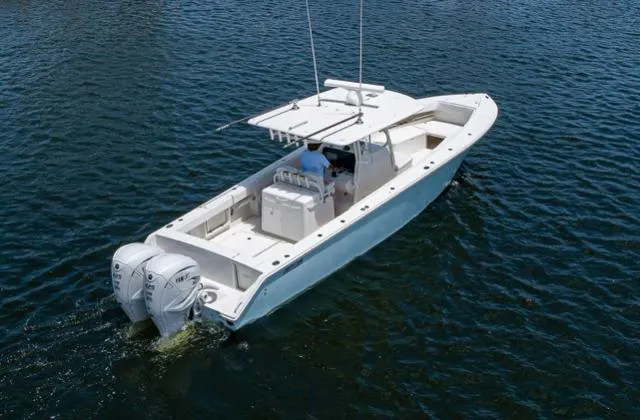 The Image of 2019 Jupiter 38 HFS boat on water, featuring dual outboard engines. - 0