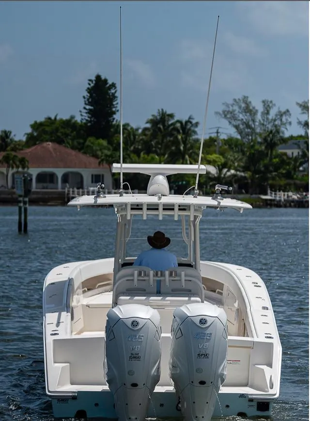 Slide: The Image of 2019 Jupiter 38 HFS boat cruising on a sunny day with twin engines. - 10