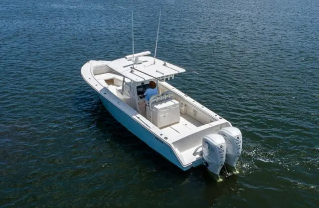 Slide: The Image of 2019 Jupiter 38 HFS boat on water with dual outboard engines. - 3