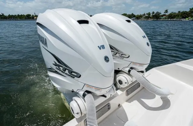Slide: The Image of Twin Yamaha V8 outboard engines on a 2019 Jupiter 38 HFS boat in water. - 7