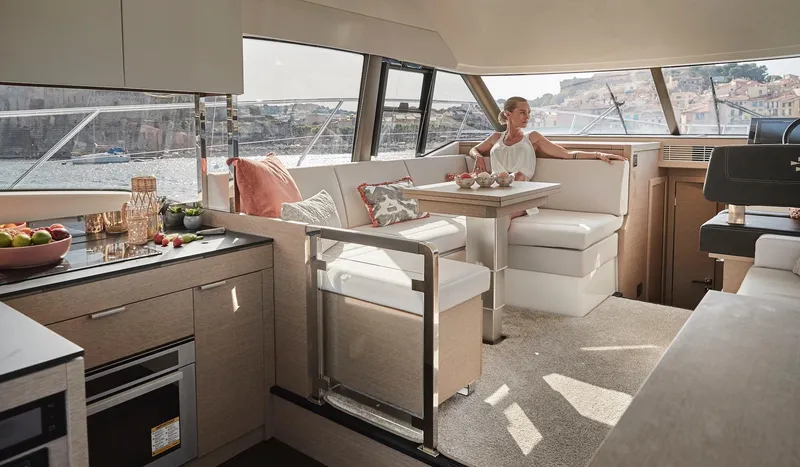 Slide: The Image of Interior of 2024 Prestige 420 yacht with modern kitchen and dining area. - 11