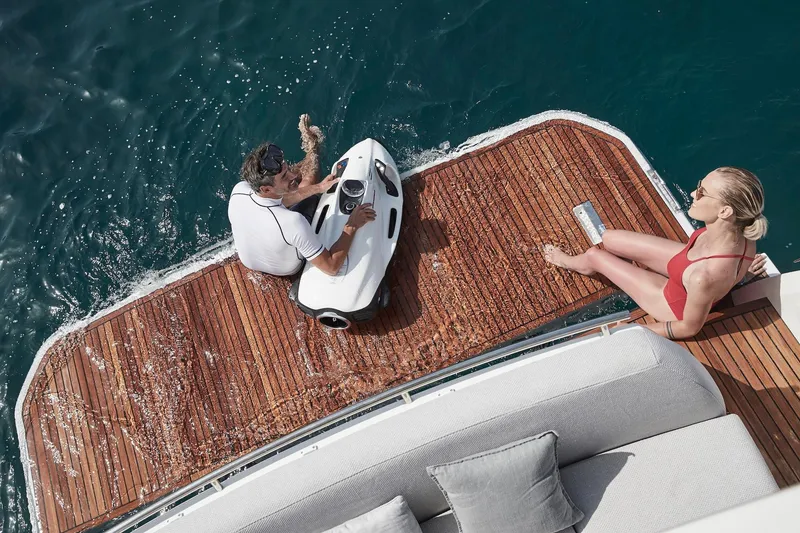 Slide: The Image of People relaxing on the deck of a 2024 Prestige 420 yacht. - 9