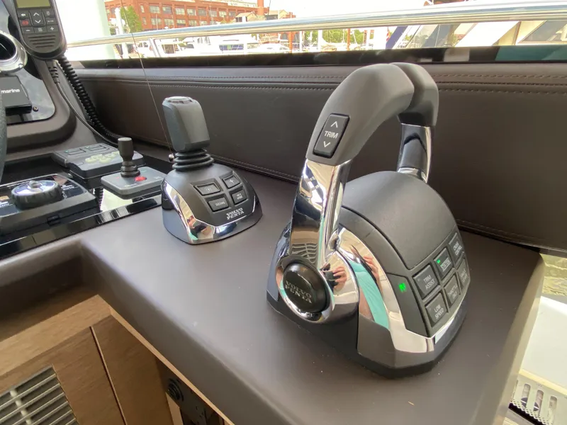 Slide: The Image of Control panel of the 2025 Prestige 520 S yacht with advanced throttle and joystick. - 16