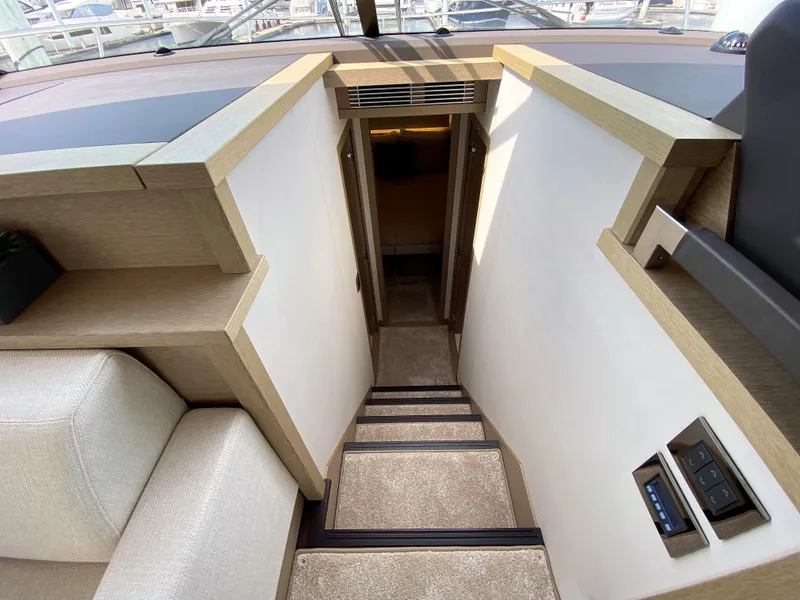 Slide: The Image of Interior stairs of 2025 Prestige 520 S yacht, leading to lower deck cabins. - 21