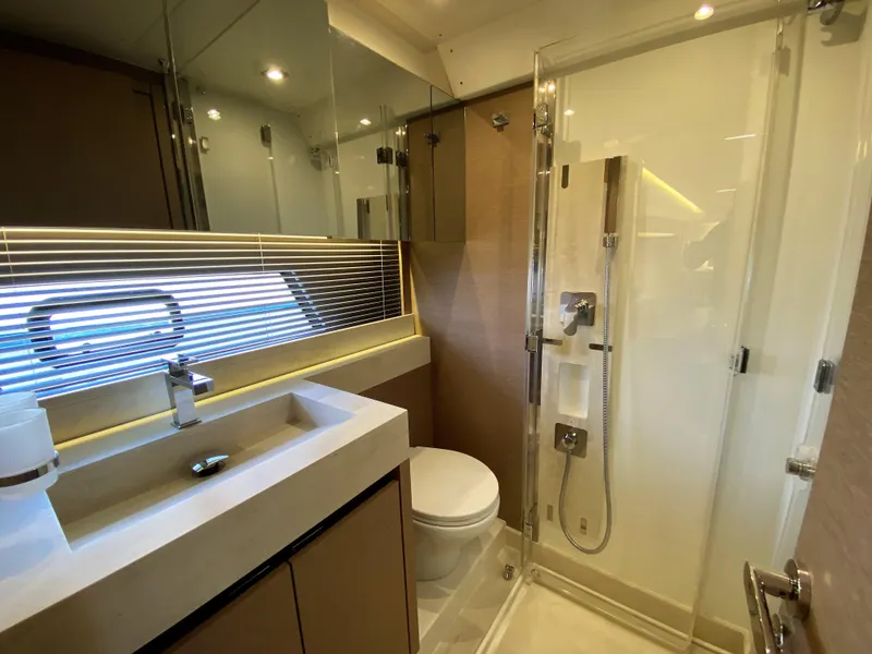 Slide: The Image of Modern bathroom in 2025 Prestige 520 S yacht with glass shower and sleek fixtures. - 25