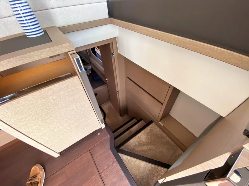 Slide: The Image of Interior stairs of Prestige 520 S yacht, 2025 model, leading to lower deck. - 28