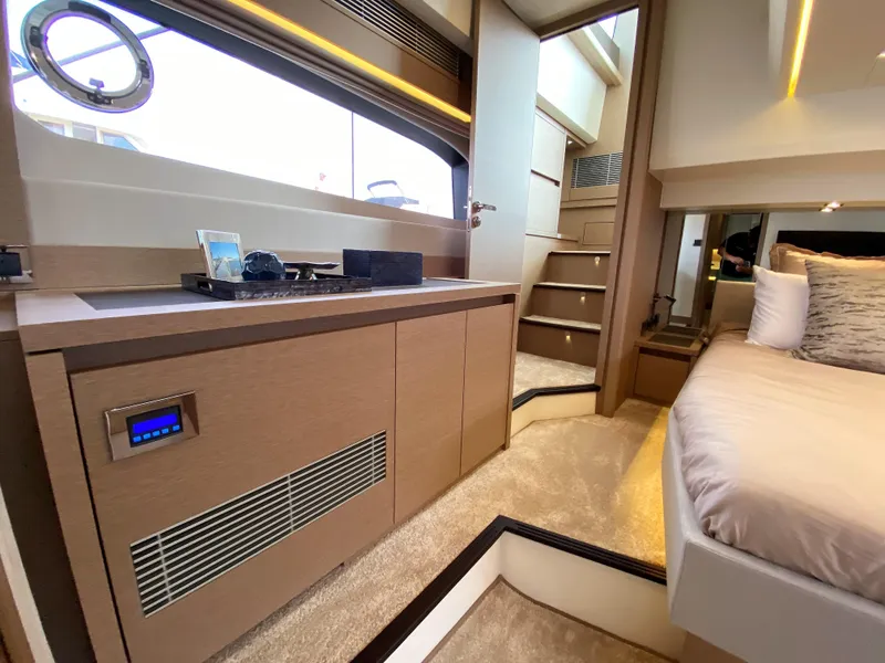 Slide: The Image of Luxurious interior of the 2025 Prestige 520 S yacht with modern furnishings. - 30