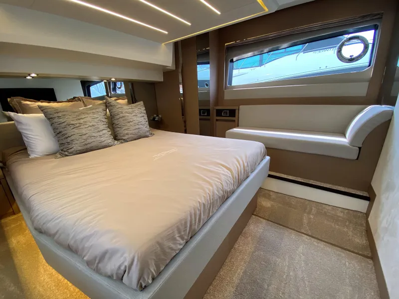 Slide: The Image of Luxurious bedroom interior of 2025 Prestige 520 S yacht with modern design and large bed. - 31