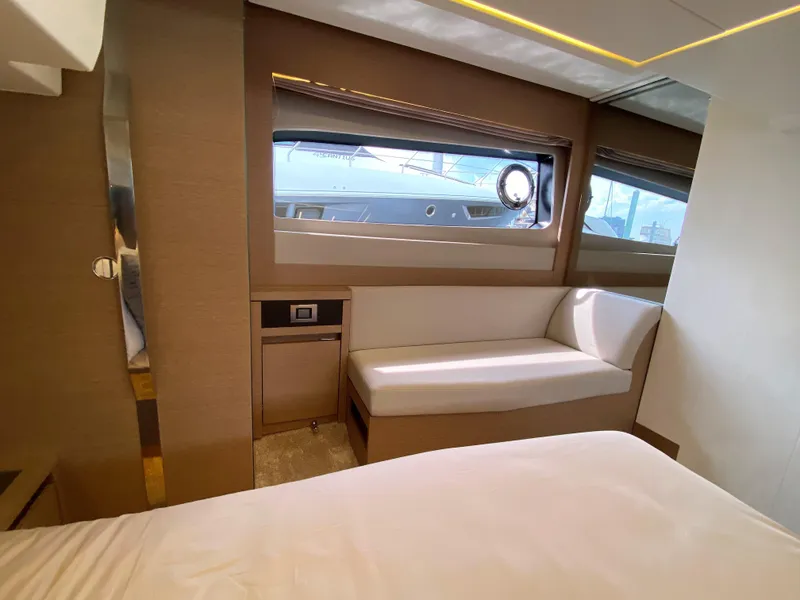 Slide: The Image of Luxurious interior of the 2025 Prestige 520 S yacht with modern seating and large windows. - 32