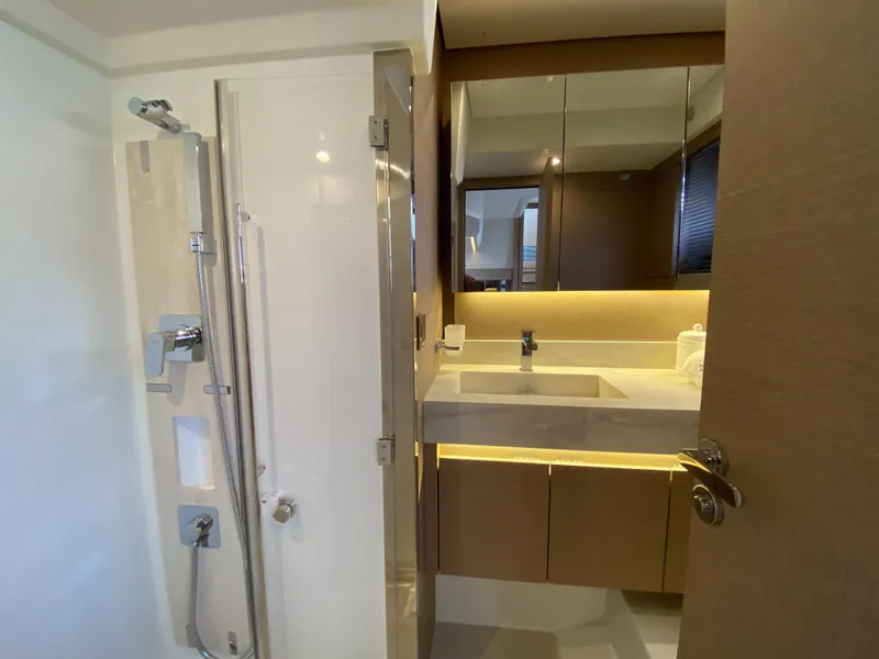 Slide: The Image of Modern bathroom in 2025 Prestige 520 S yacht with shower and illuminated vanity. - 34