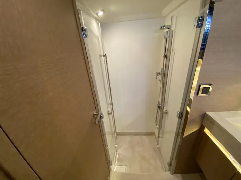 Slide: The Image of Modern bathroom in 2025 Prestige 520 S yacht with glass shower enclosure. - 36